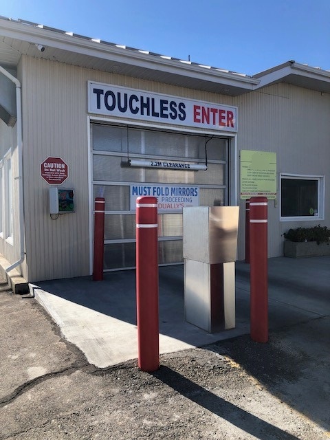 Car wash protected by bollards